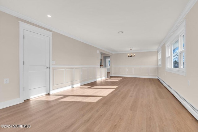 interior space with ornamental molding, a baseboard heating unit, an inviting chandelier, and light wood-type flooring