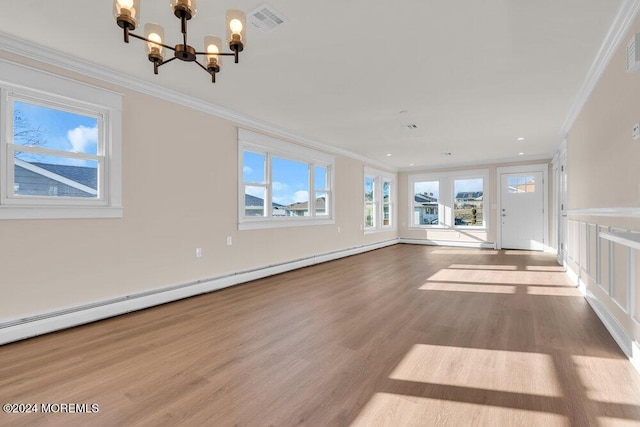 unfurnished living room featuring baseboard heating, ornamental molding, a chandelier, and light wood-type flooring