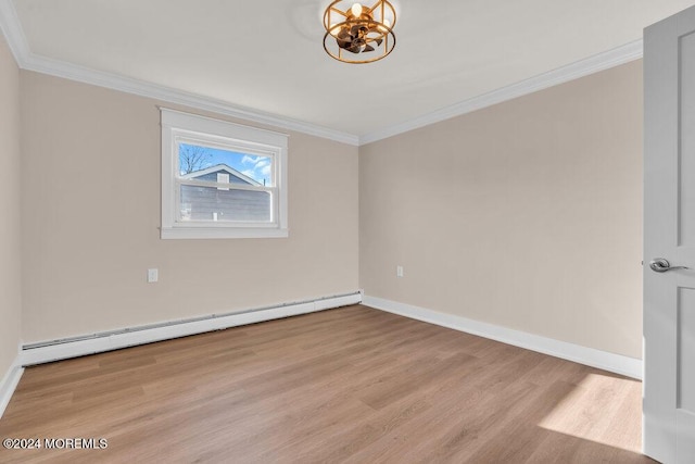 spare room featuring a baseboard radiator, crown molding, and light hardwood / wood-style flooring