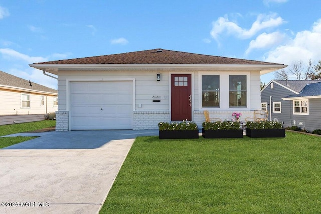 view of front of house with a garage and a front lawn