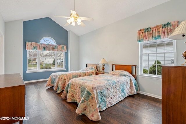 bedroom featuring dark hardwood / wood-style flooring, ceiling fan, and lofted ceiling