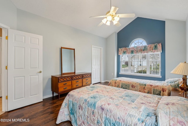 bedroom featuring ceiling fan, dark hardwood / wood-style flooring, and lofted ceiling