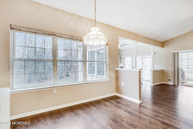 unfurnished dining area featuring dark hardwood / wood-style flooring and lofted ceiling