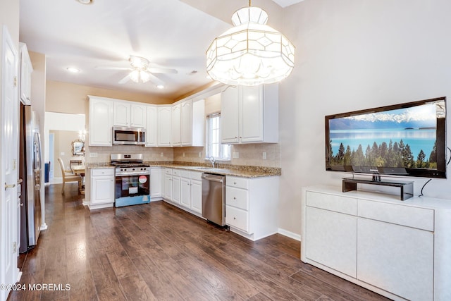 43 Spyglass Dr, Jackson, NJ 08527 - kitchen featuring stainless steel appliances, ceiling fan, tasteful backsplash, dark wood-style floors, and white cabinets