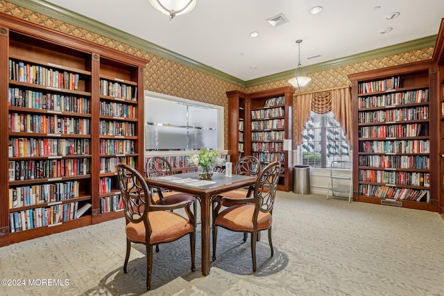 dining space with carpet and ornamental molding