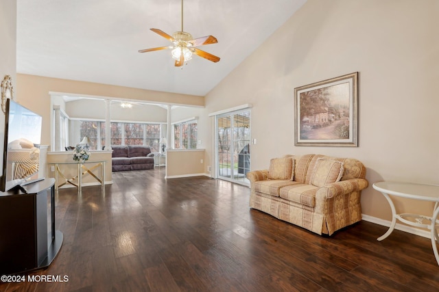 living room with ceiling fan, dark wood-type flooring, and high vaulted ceiling