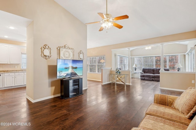 living room featuring ceiling fan, dark hardwood / wood-style flooring, and high vaulted ceiling