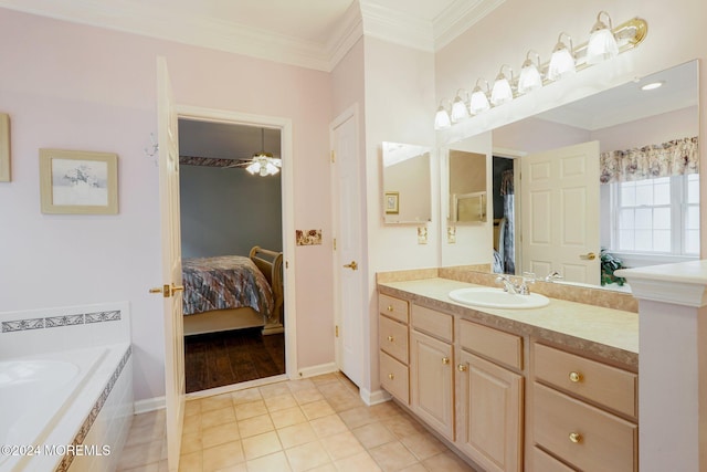 bathroom with ceiling fan, tile patterned floors, tiled tub, vanity, and ornamental molding