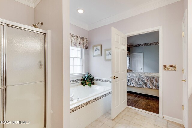 bathroom featuring shower with separate bathtub, tile patterned floors, and crown molding