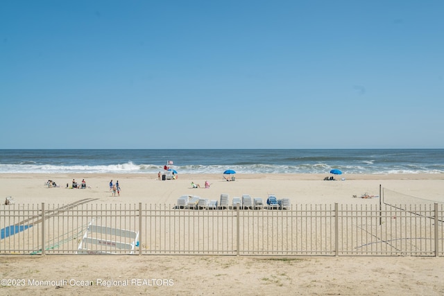 view of water feature with a beach view