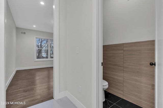 bathroom featuring tile patterned floors and toilet