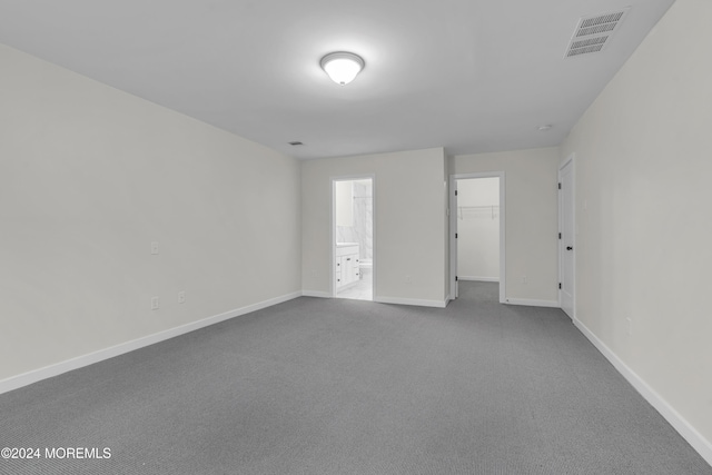 spare room with light colored carpet