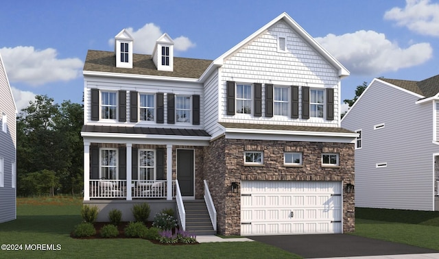 view of front of house with a front yard, a porch, and a garage