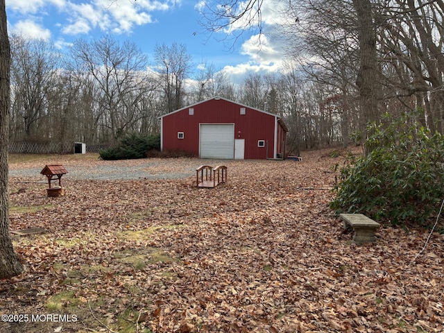 view of yard featuring an outbuilding and a garage