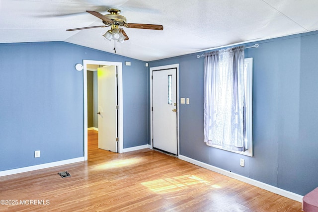 8 Monique Cir, Hazlet, NJ 07730 - spare room with ceiling fan, visible vents, vaulted ceiling, baseboards, and wood finished floors