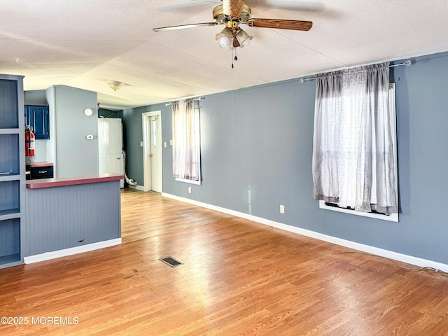 8 Monique Cir, Hazlet, NJ 07730 - unfurnished room featuring wood finished floors, visible vents, a ceiling fan, and baseboards