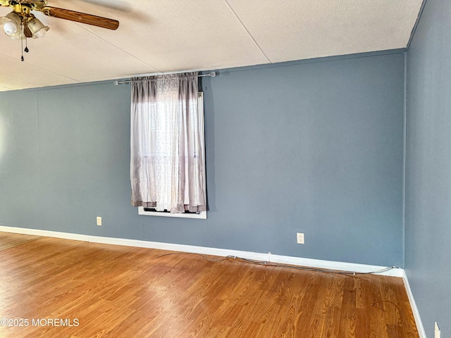 8 Monique Cir, Hazlet, NJ 07730 - spare room featuring wood finished floors, ceiling fan, and baseboards