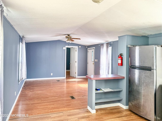 8 Monique Cir, Hazlet, NJ 07730 - kitchen featuring freestanding refrigerator, light wood-style floors, ceiling fan, baseboards, and lofted ceiling