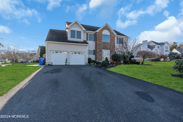 view of property featuring a front lawn