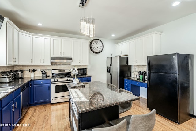 kitchen with black appliances, blue cabinetry, a notable chandelier, a kitchen island, and white cabinetry