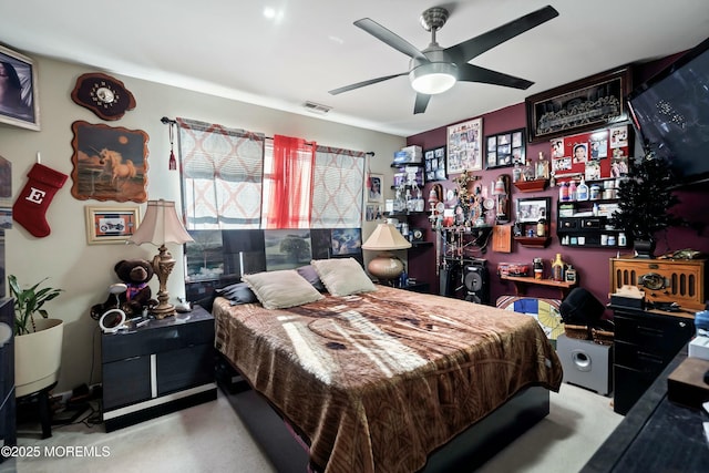 bedroom with ceiling fan and indoor bar