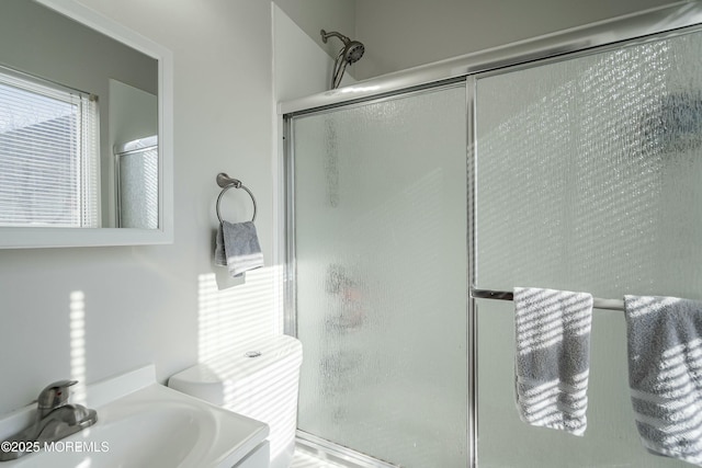 bathroom featuring vanity and walk in shower