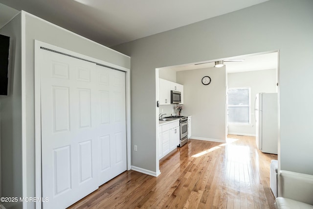 interior space with white fridge and light hardwood / wood-style floors