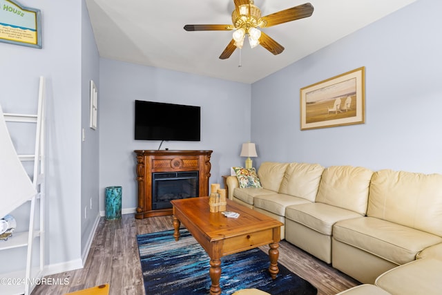 living room with ceiling fan and hardwood / wood-style floors