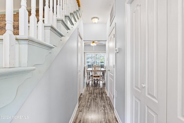 corridor with dark hardwood / wood-style floors