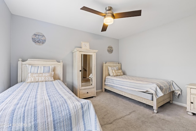 bedroom with ceiling fan and light colored carpet