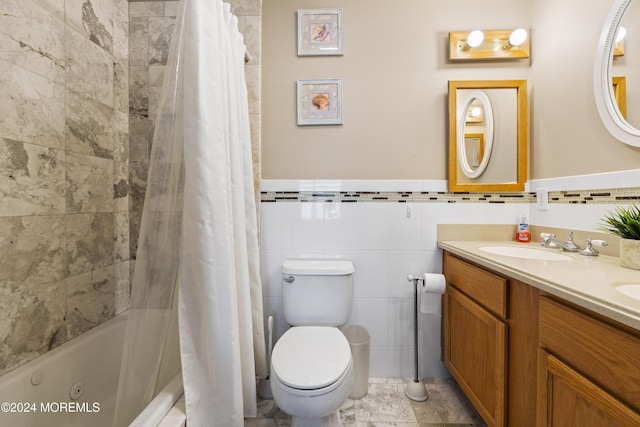 full bathroom with shower / tub combo, vanity, toilet, and tile walls