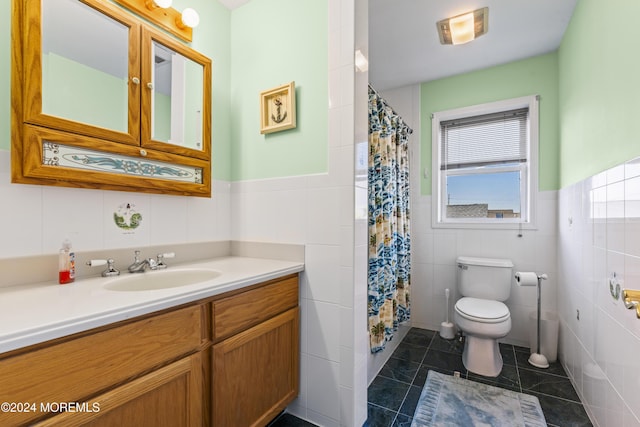 bathroom featuring tile patterned floors, a healthy amount of sunlight, and tile walls