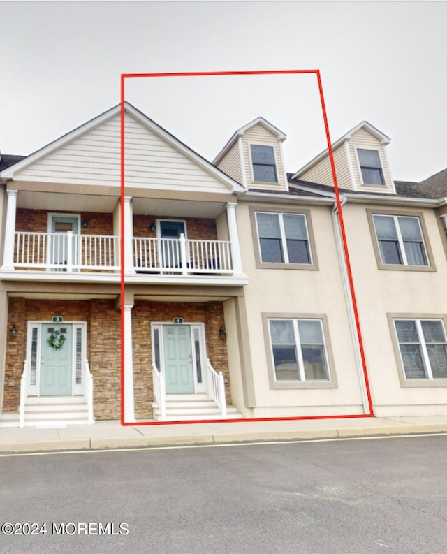 view of property with a balcony