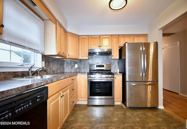 kitchen with backsplash, light brown cabinets, sink, and stainless steel appliances