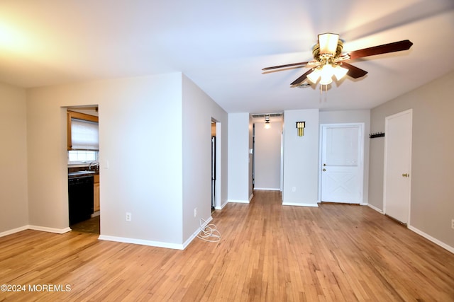 spare room with light wood-type flooring and ceiling fan