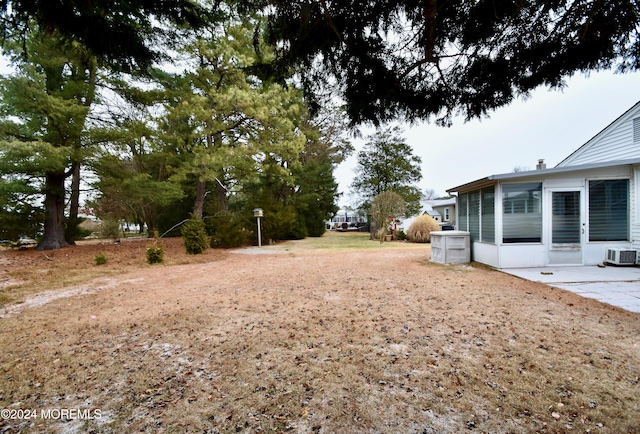 view of yard featuring a sunroom