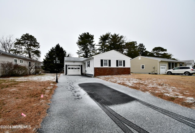 ranch-style house featuring a garage