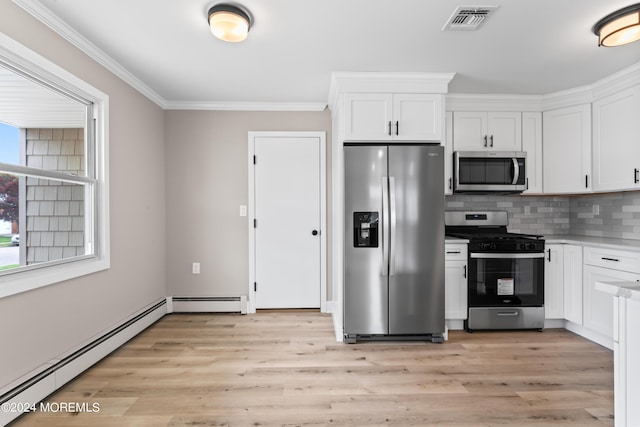 kitchen featuring stainless steel appliances, white cabinetry, a baseboard heating unit, and light hardwood / wood-style flooring