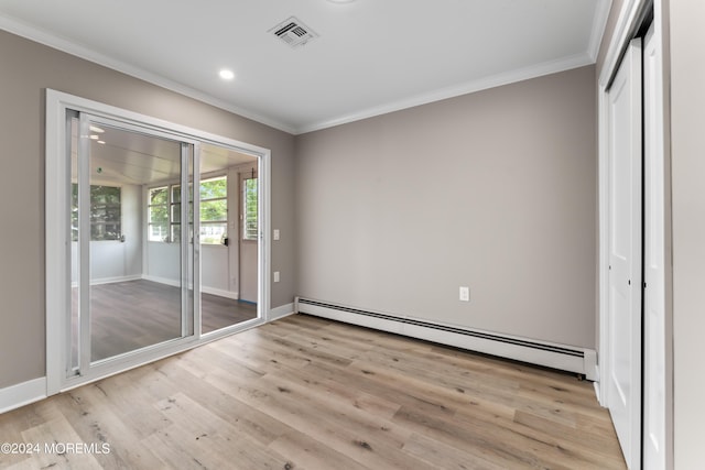 unfurnished bedroom with light hardwood / wood-style floors, baseboard heating, and crown molding