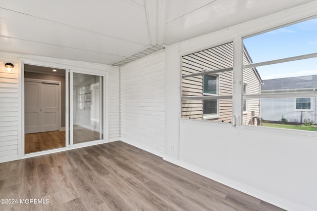 unfurnished sunroom featuring a wealth of natural light