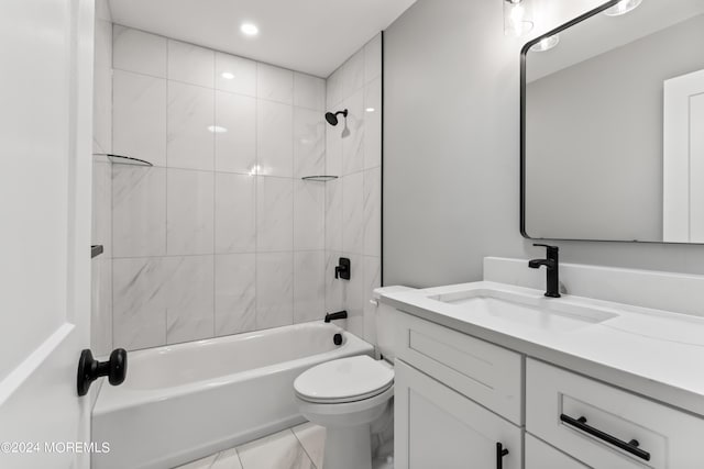 full bathroom featuring tile patterned floors, toilet, vanity, and tiled shower / bath