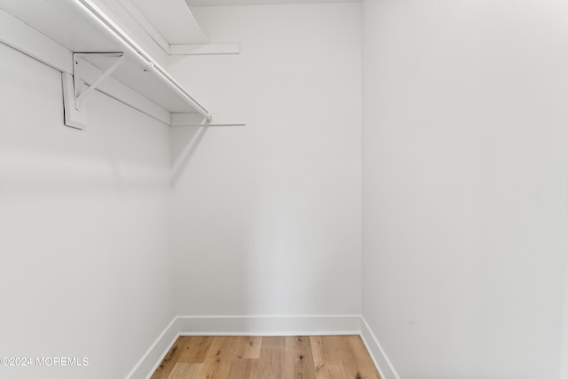 walk in closet featuring hardwood / wood-style floors