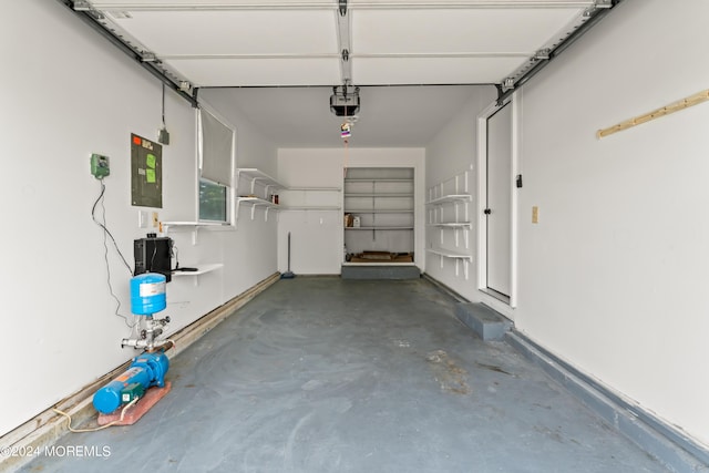 garage featuring a garage door opener and electric panel