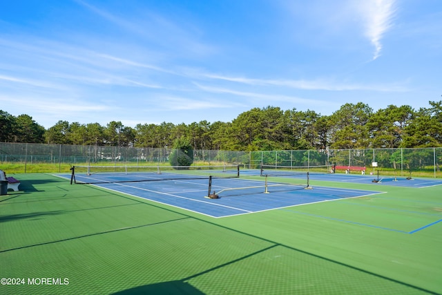 view of sport court with basketball hoop