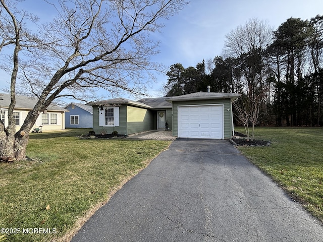 ranch-style house with a front yard and a garage