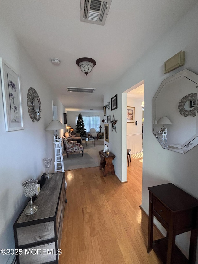 hallway featuring light hardwood / wood-style flooring