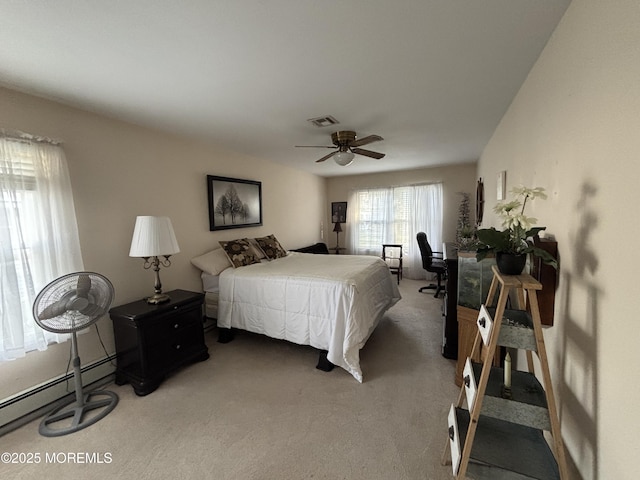 bedroom featuring ceiling fan, carpet floors, and baseboard heating