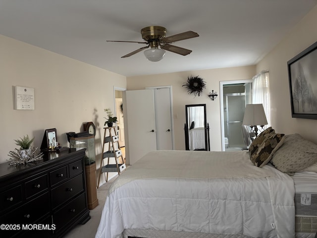 bedroom featuring ensuite bathroom, ceiling fan, and light colored carpet