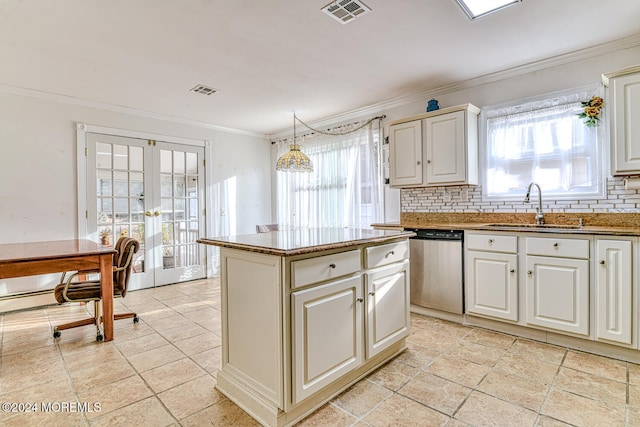 kitchen with french doors, backsplash, sink, pendant lighting, and dishwasher