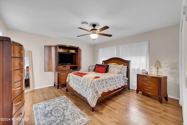 bedroom featuring ceiling fan and light hardwood / wood-style floors